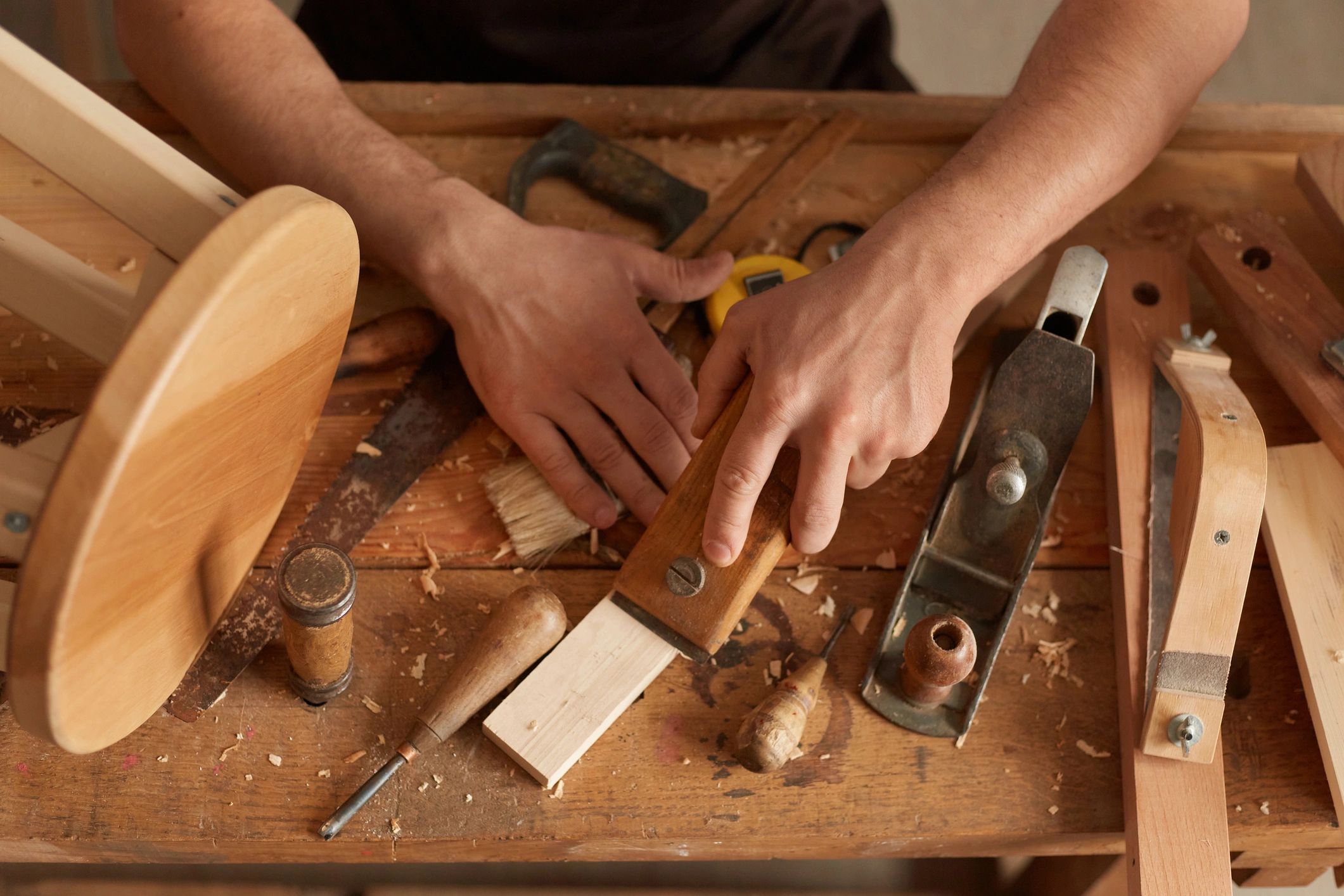Carpenter working carefully on wood detail