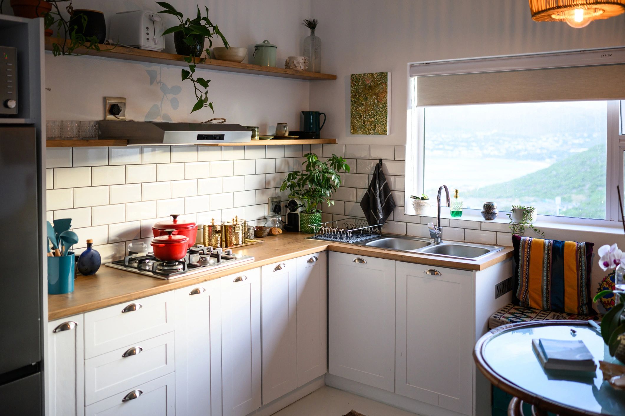 Modern kitchen with custom cabinets and wood shelving