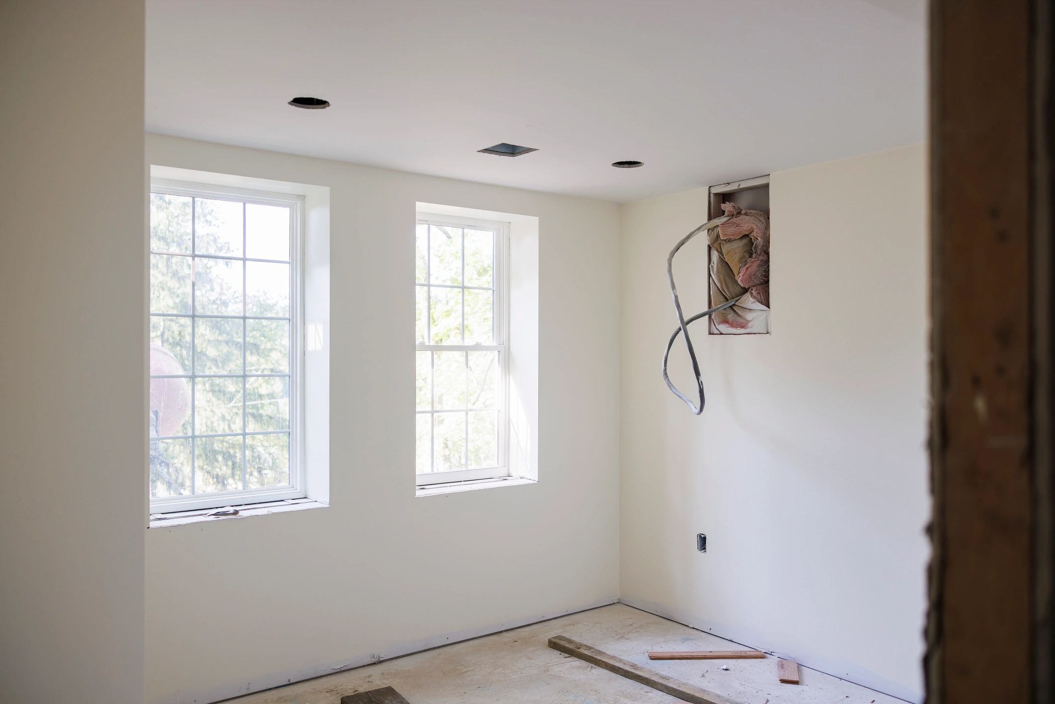 Bright unfinished interior room during residential remodeling